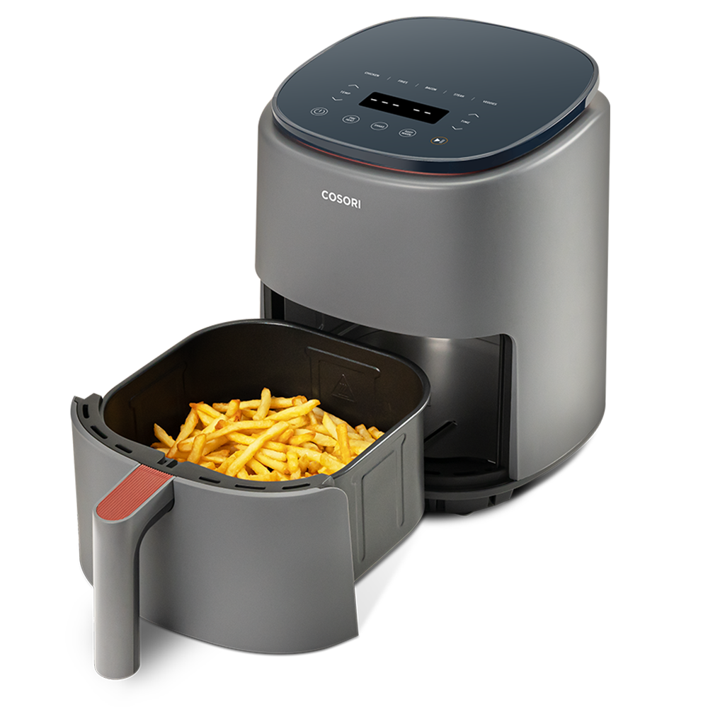 COSORI Lite 4.0-Quart Smart Air Fryer with basket pulled out showing cooked fries