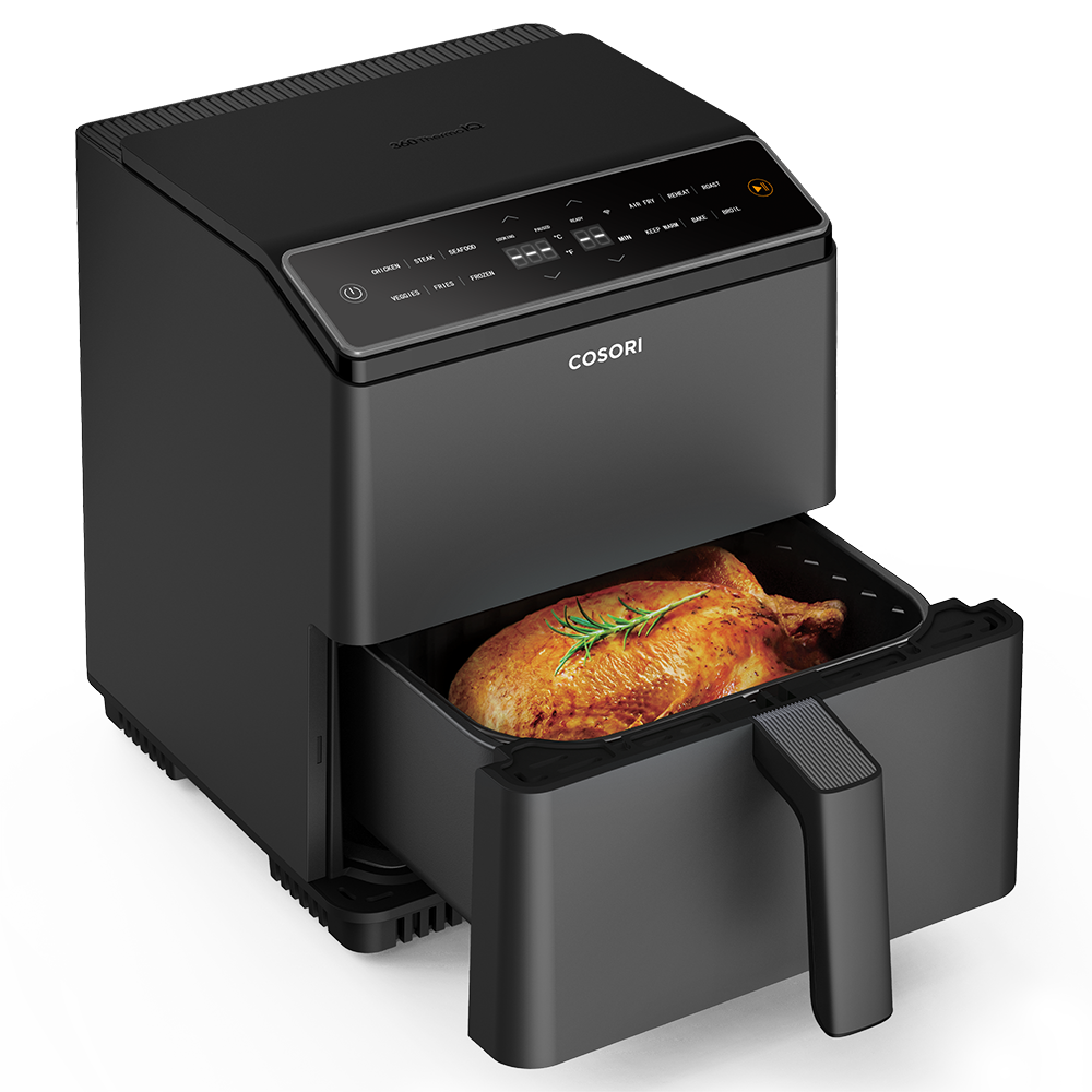 COSORI Dual Blaze 6.8-Quart Smart Air Fryer with basket pulled out showing roasted chicken