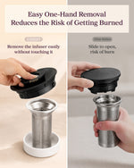 Hand lifting the stainless steel tea infuser out of the COSORI kettle without touching hot parts