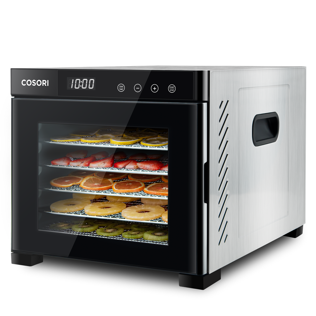Angled view of COSORI stainless steel food dehydrator with food drying on trays