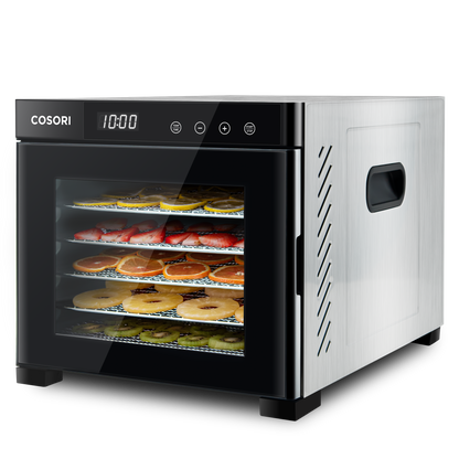 Angled view of COSORI stainless steel food dehydrator with food drying on trays