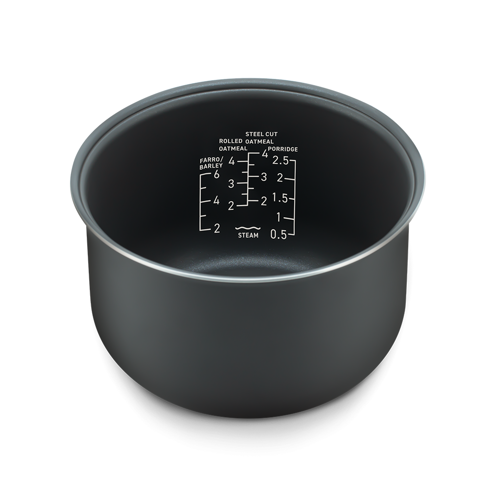 Angled view of the inner pot showing clear water measurement markings for different grain types.