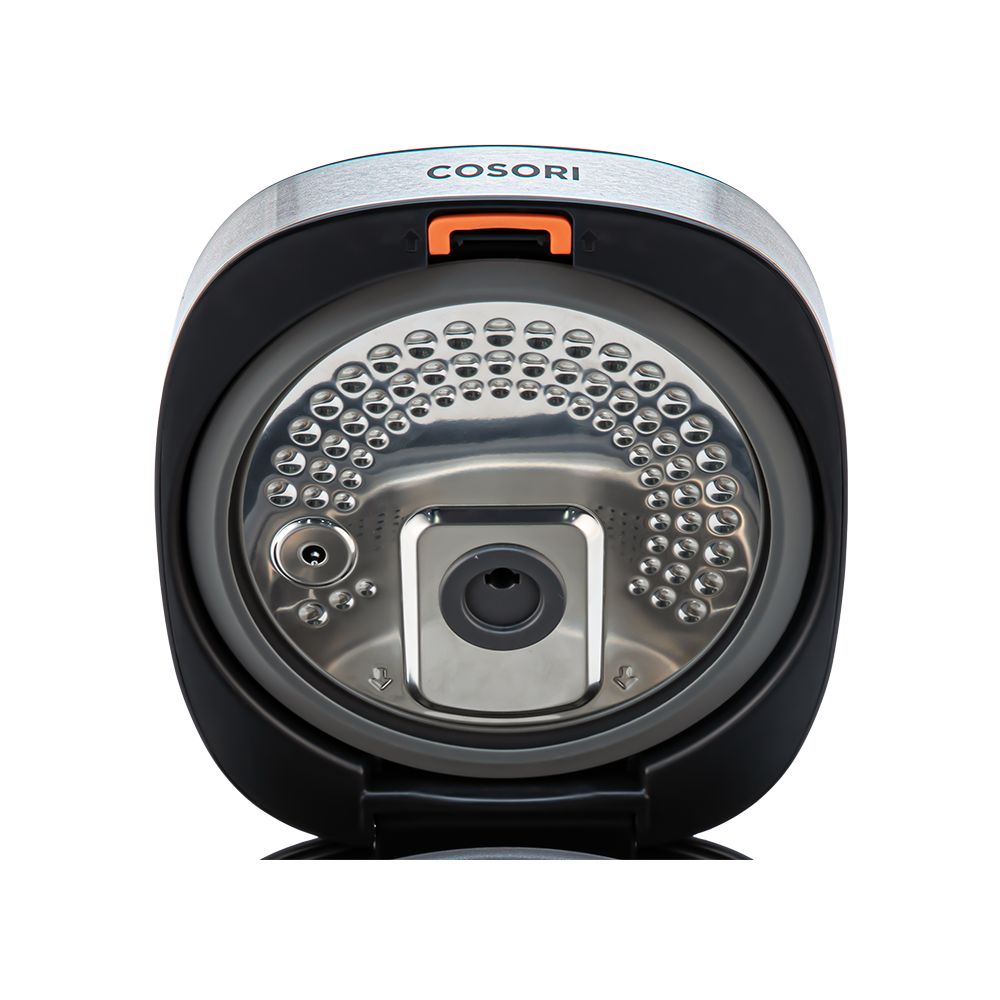 Close-up view of the detachable inner lid inside the Cosori Rice Cooker.