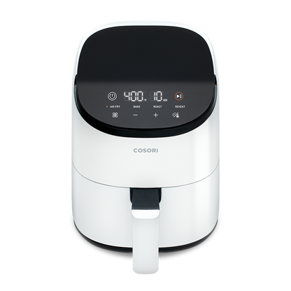 High-angle front view of the white Cosori Mini Air Fryer showing the sleek, modern housing