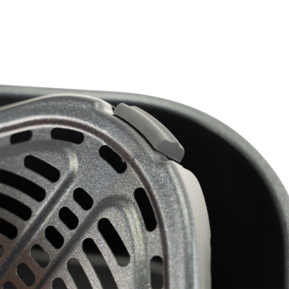 Close-up of nonstick crisper plate inside COSORI Lite 4.0-Quart Smart Air Fryer basket
