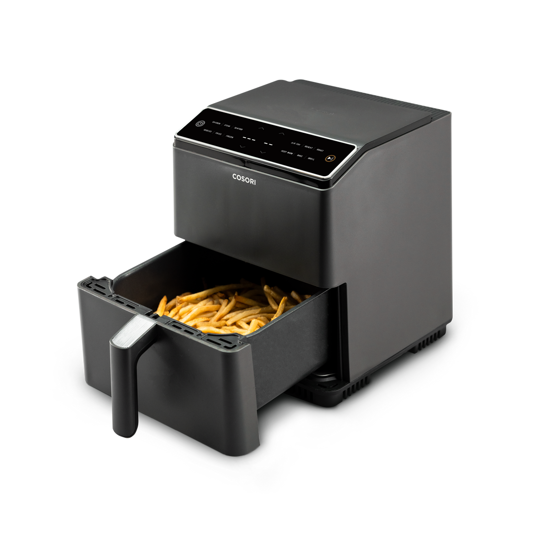 COSORI Dual Blaze 6.8-Quart Smart Air Fryer with basket extended showing cooked fries