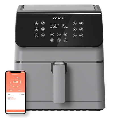 Cosori Pro II 5.8-Qt Smart Air Fryer in grey shown with a smartphone displaying the VeSync app control.