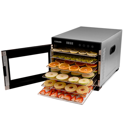 COSORI food dehydrator with door open showing trays filled with sliced fruit